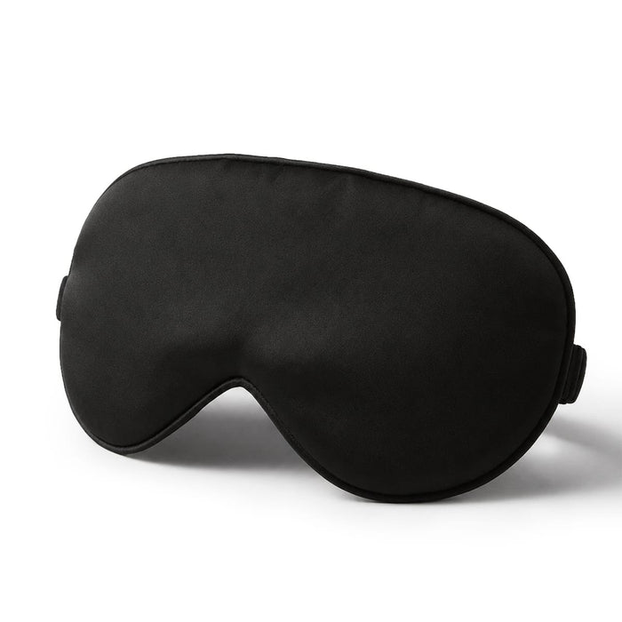 Svart sömnmask i siden med enkel design och elastiskt band, avbildad mot en vit bakgrund.